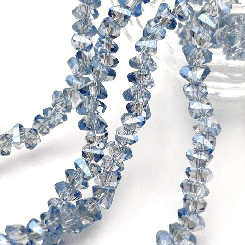 Намистини Swarovski огранювання трикутник 4 мм 35 см (+-130 шт.) Сріблястий АВ прозорий
