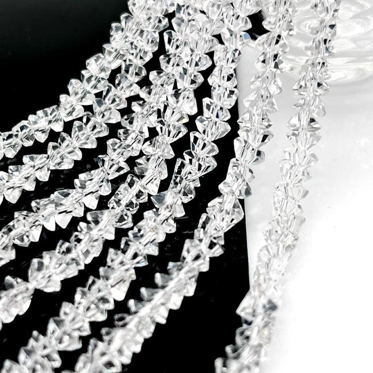 Намистини Swarovski ограновування трикутник 2 мм 22 см (+-148 шт.) Прозорий