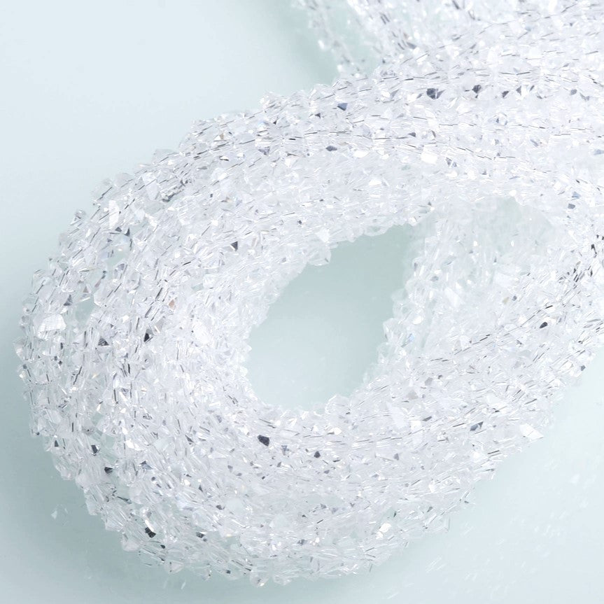 Намистини Swarovski ограновування трикутник 6 мм 30 см (+-85 шт.) Прозорий