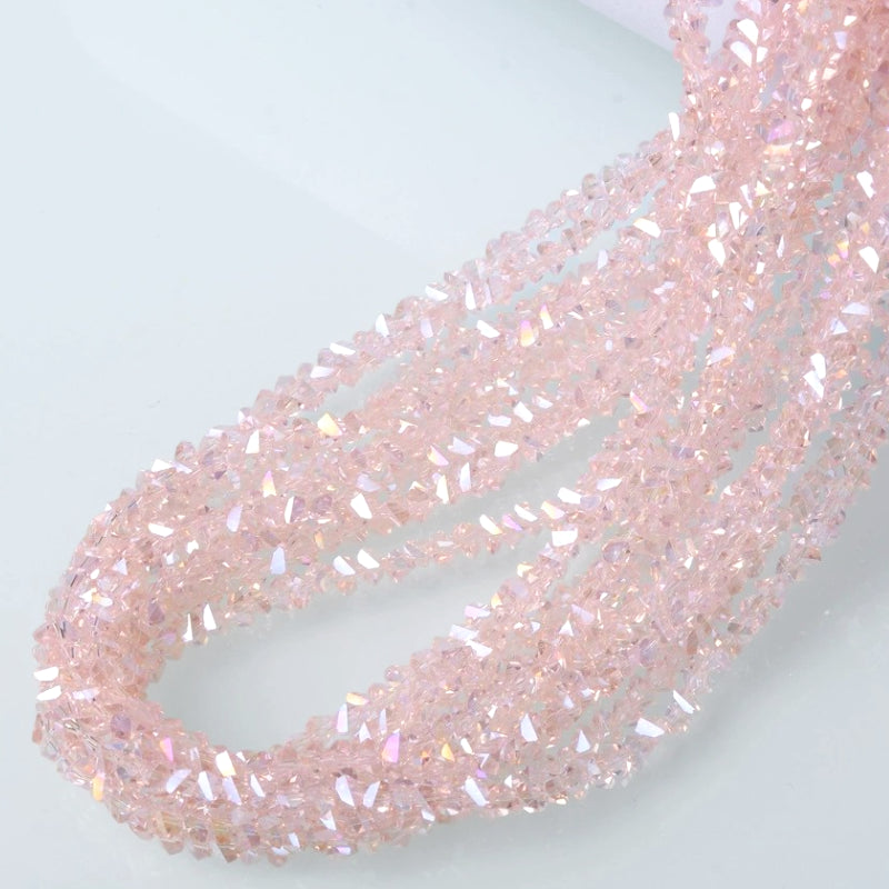 Намистини Swarovski ограновування трикутник 6 мм 30 см (+-85 шт.) Пудровий АВ прозорий